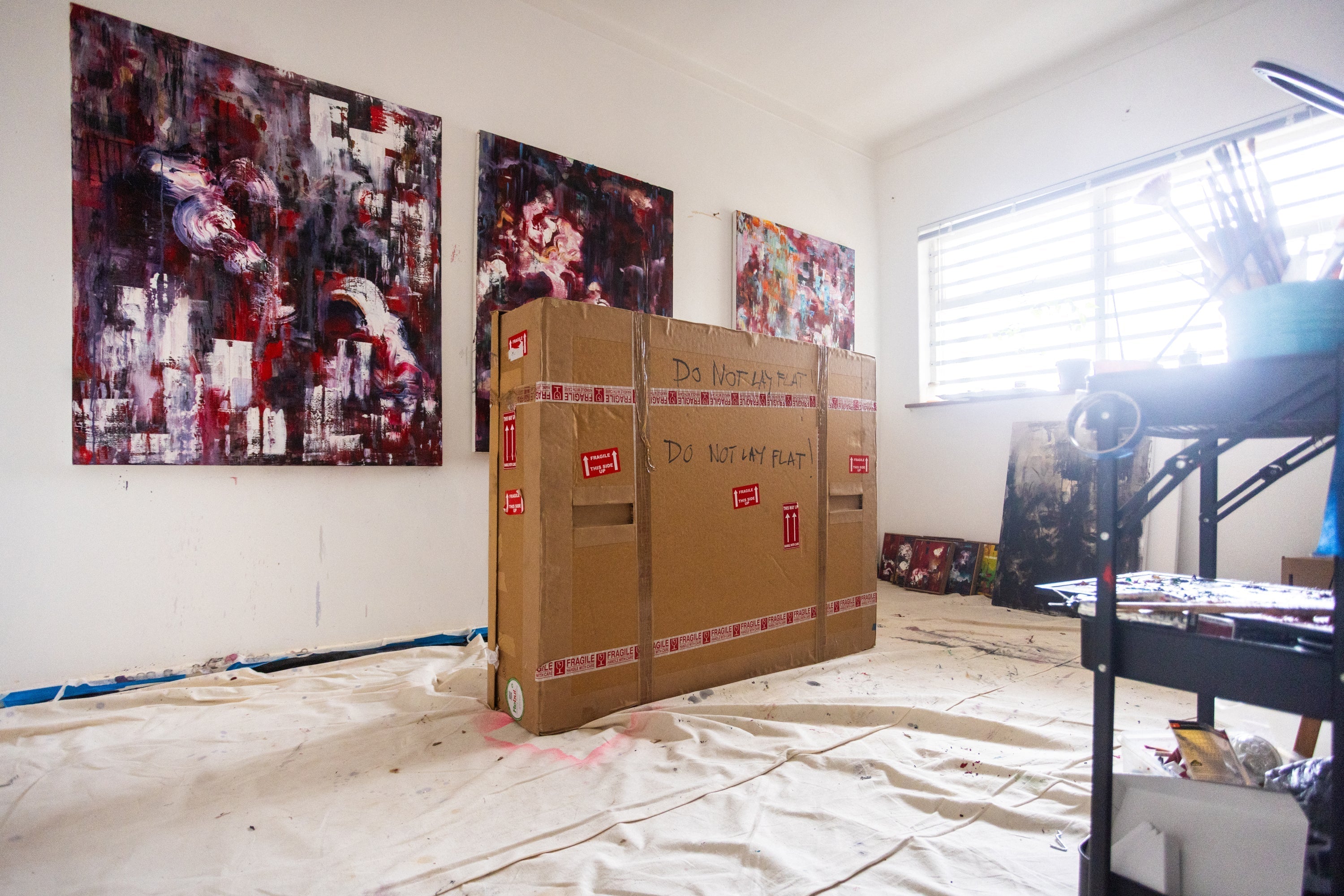 PSA for artists and collectors: To roll or not to roll, that is the question.